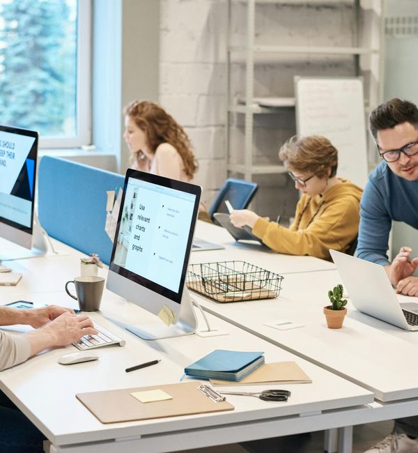 A person sitting at a modern desk looking refreshed.